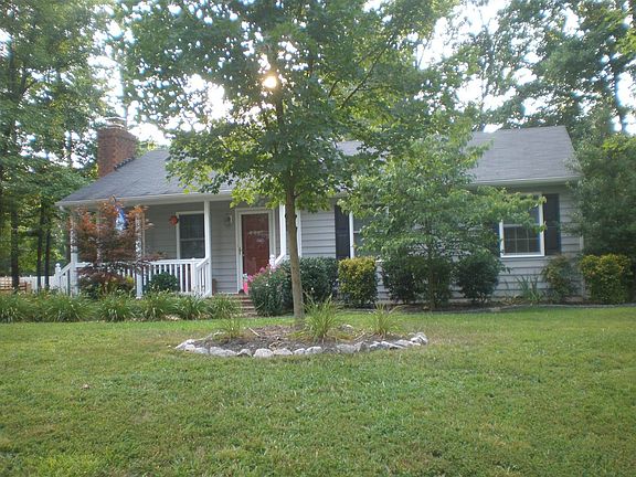 Nicely Landscaped with flowerbeds, fruit trees & garden spot