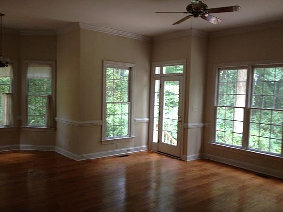 living room overlooks heavily wooded back area