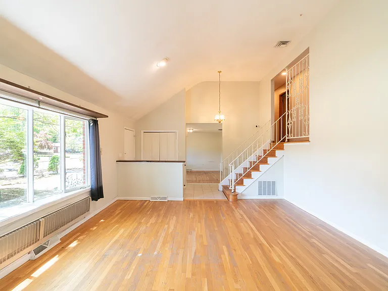 living room has vaulted 20ft ceiling, large 15ft picture window