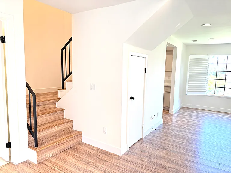 Staircase to 2nd level rooms and laundry