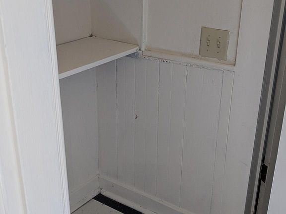 Kitchen pantry and entry into bathroom and second bedroom