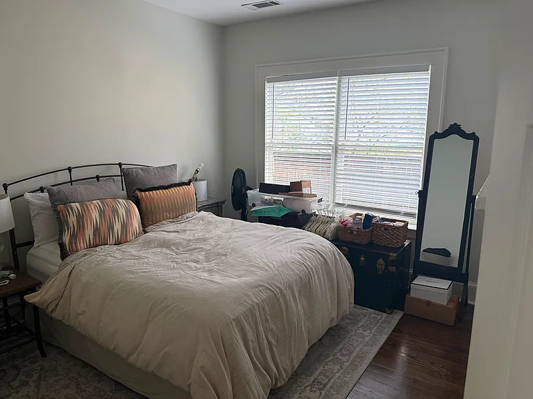middle bedroom with small storage closet..nice light with double windows and skylight
