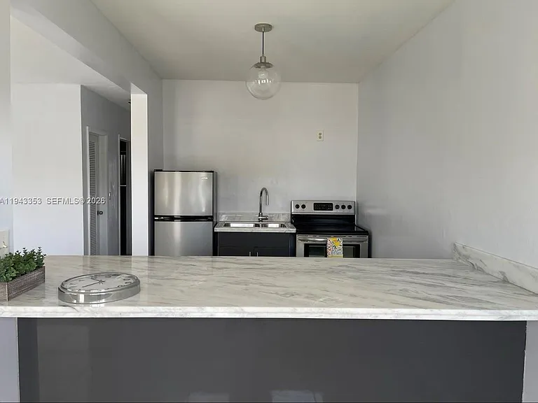 455 Golden Isles Dr #107 — Photo 3