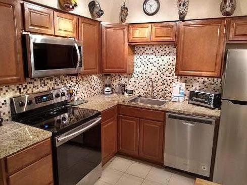 Tile backsplash Granite tile counter stop.