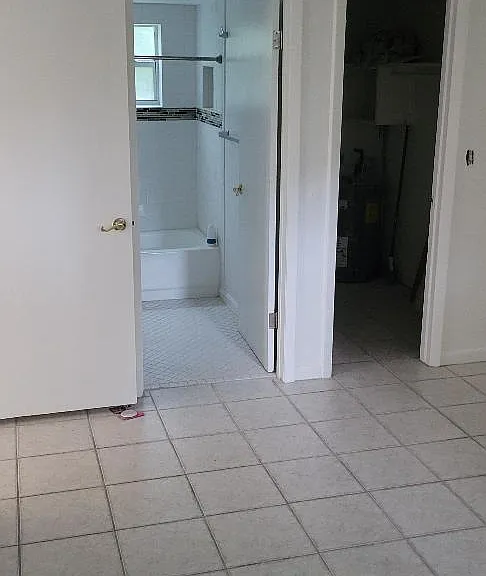 Bedroom pic shows bathroom door and walk-in closet door.