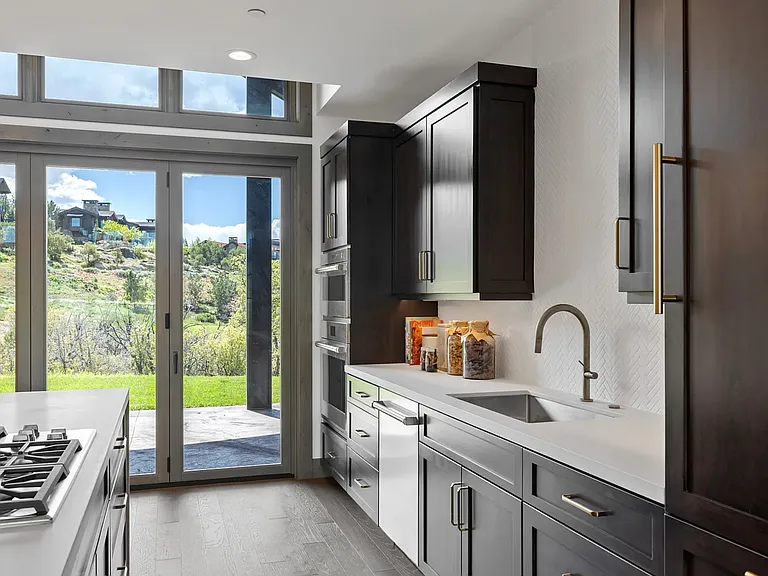 Kitchen includes all appliances, dishware.