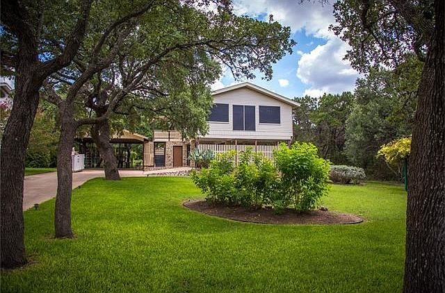 The home at 14912 Arrowhead Drive is on about 1/3 of an acre with large trees at the front and backyard.
