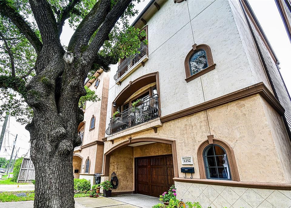 The front of this home is fantastic and look at the magnificent tree!