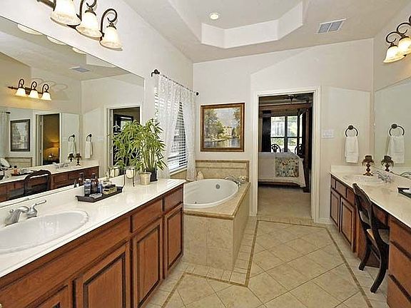 Master Bathroom with jetted tub and seperate shower and large walk-in closet