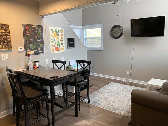 Unit 4 living room with high ceiling
