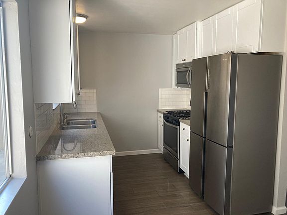 Galley kitchen with new appliances