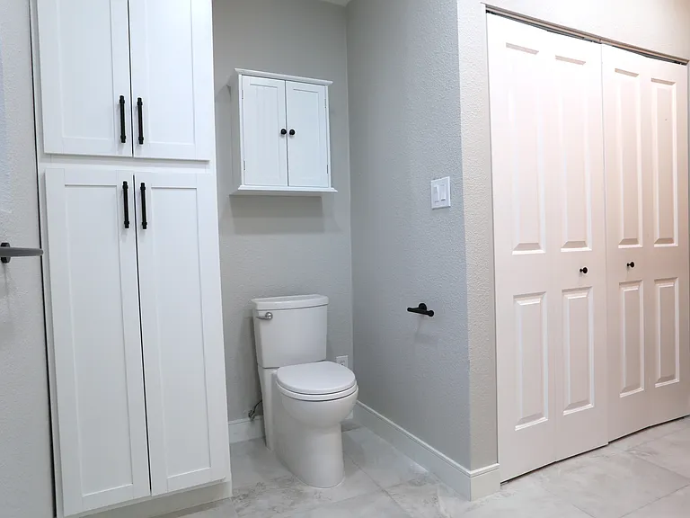 primary bedroom #1 bathroom and laundry area (behind folding doors)