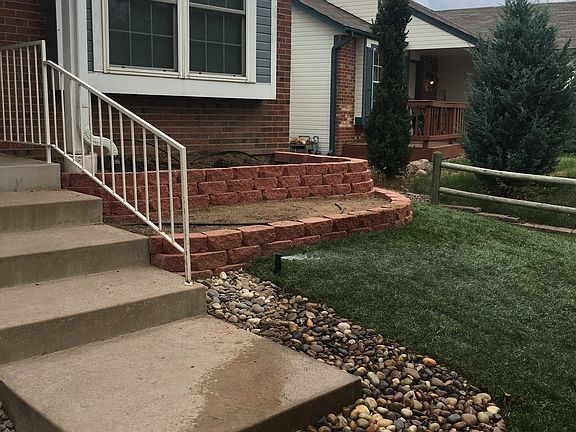new landscaping in front yard, planters waiting for the fini