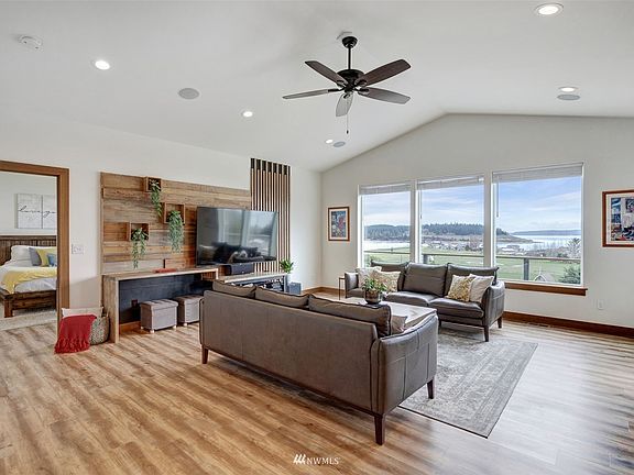 One is immediately drawn to the views as you walk inside the great room set up for relaxing or entertaining.