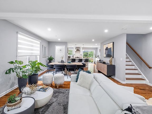 Open concept Living/Dining Room, Gourmet Kitchen with adjacent deck facing woods