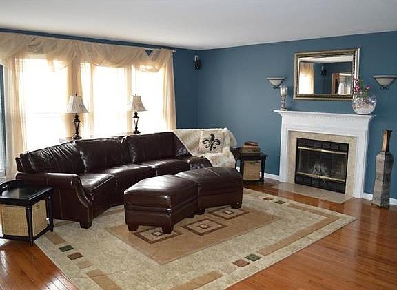 Cozy Family Room with WoodBurning Fireplace and Plenty of Natural Light