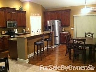 Dining/Kitchen
						:
						All countertops throughout the house are granite