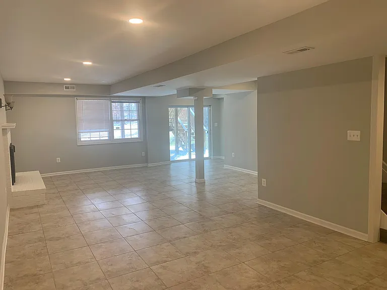 Basement Recreation Room - Glass Door leads to Patio/Backyard