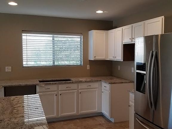 Kitchen with stainless steel appliances and granite countertops