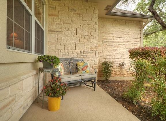 The covered front porch is the perfect spot for a piece or two of patio furniture.