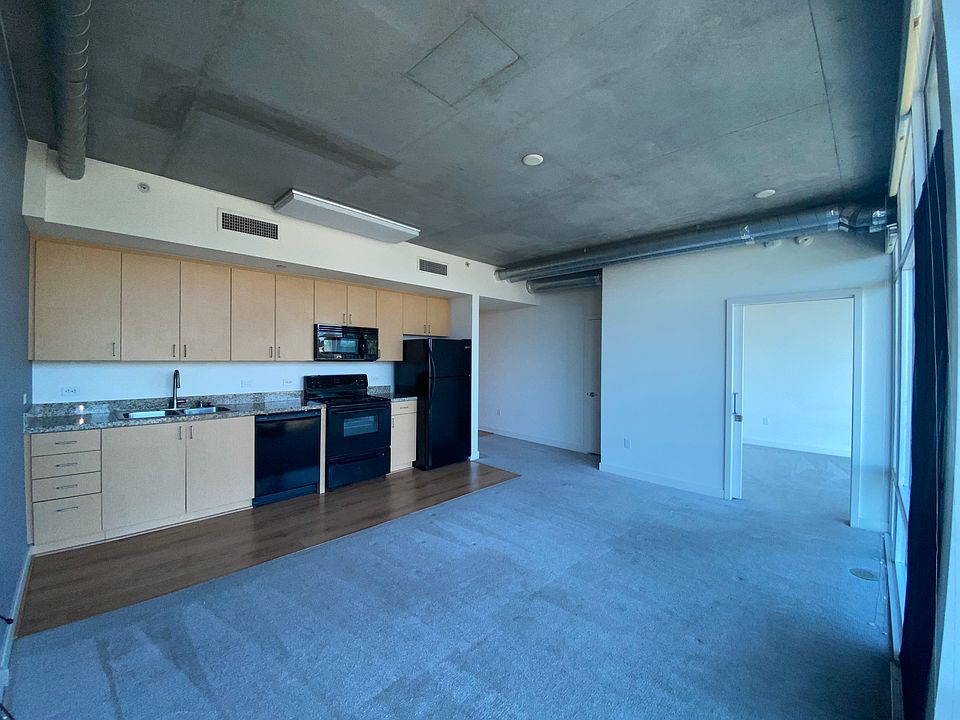 Living Room & Kitchen (bedroom blinds open)