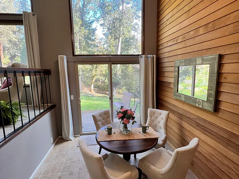 Dining room leads to the patio, lawn and gardens