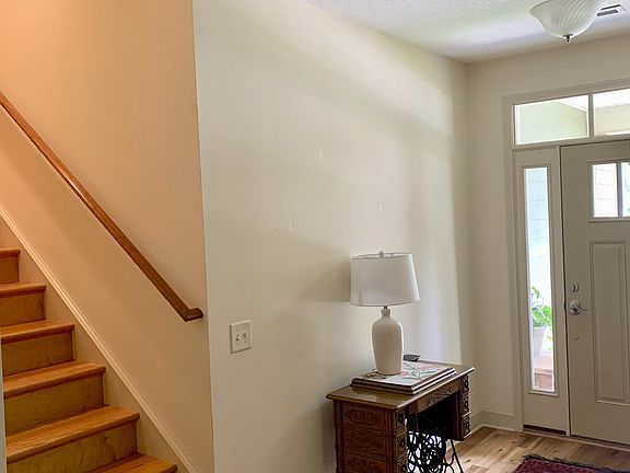 Staircase to tenants private space and separate walk-in attic