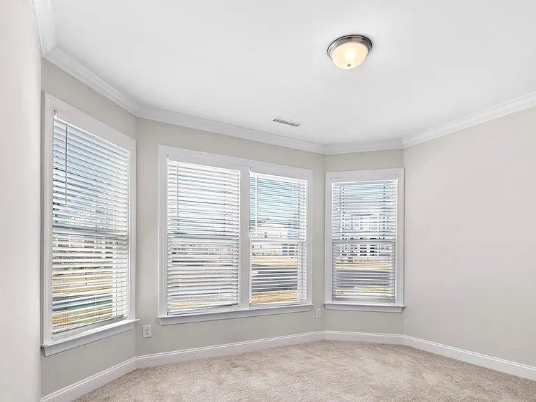 Downstairs bedroom with large bay windows