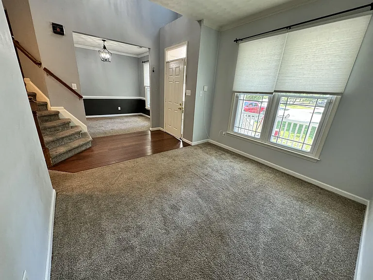 Formal living room looking into front entry and dining room