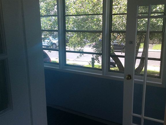 This a good size porch with freshly painted walls & floors...