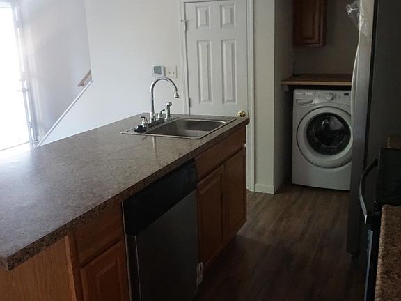 Washer & Dryer in side nook of kitchen, dishwasher in island