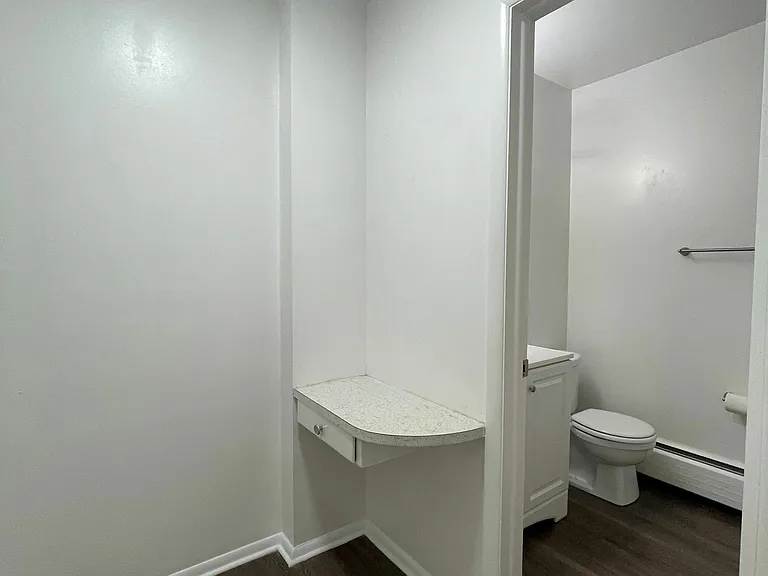 Explore the charming corner leading to a modern bathroom. Explore the charming corner leading to a modern bathroom.