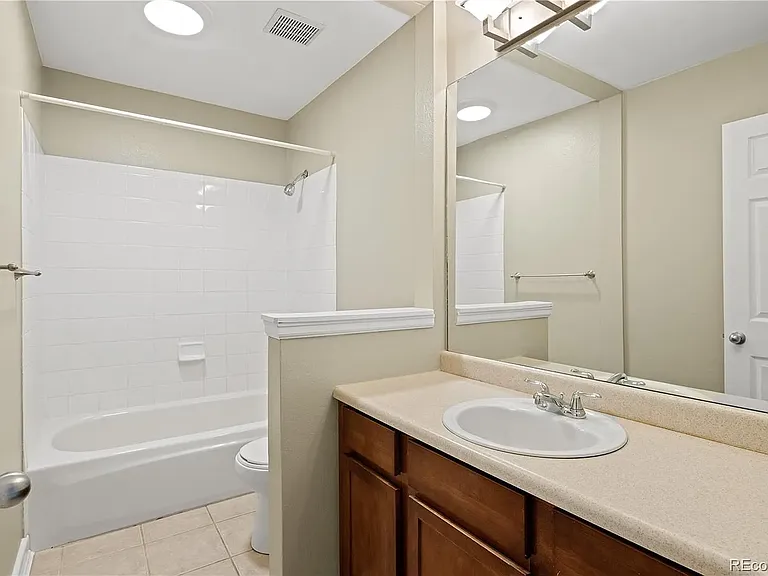 Upstairs full bathroom. (upgraded toilet, sink, sink fixtures, and shower hardware not pictured)