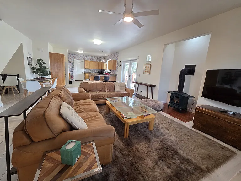 Living room view of french-door entry and kitchen.