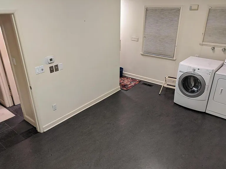 Large Laundry Room with double sliding door cleaning closet (around the corner}