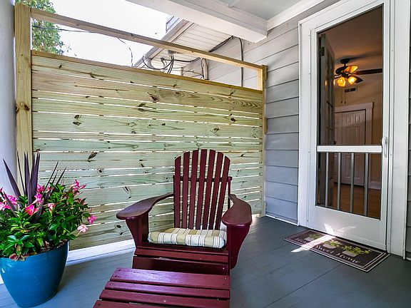 Private covered front porch to relax on.