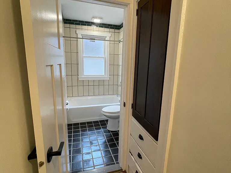 built-in linen closet and bathroom