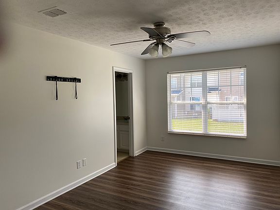 Master bedroom with walk in closet, private bath and a place for your tv already mounted!