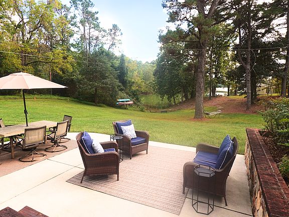 Walk out of the living room and onto the patio overlooking the water