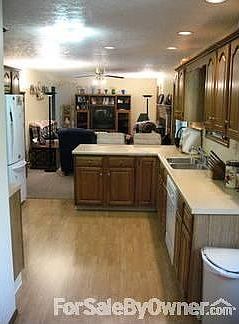 Kitchen
						:
						View of kitchen into the family room