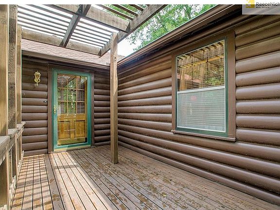 Cedar deck leading to the front door.