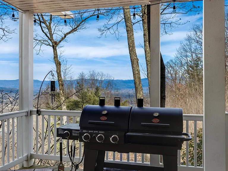 Lower level deck with smoker bbq, picnic table and views.
