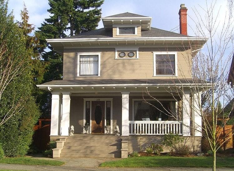 Classic four-square home in the heart of Capitol Hill with large rocking chair porch.