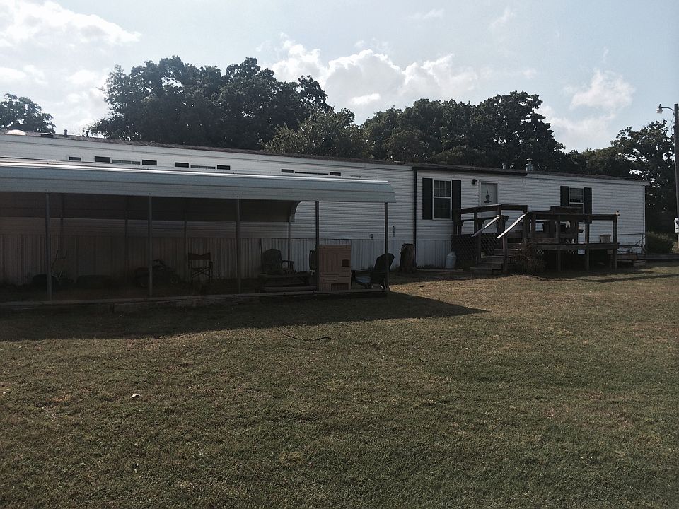 Two car carport in front 