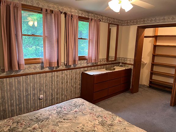 Master bedroom with small walk in closet