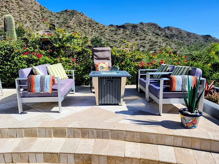 Elevated conversation area with pool and mountain views