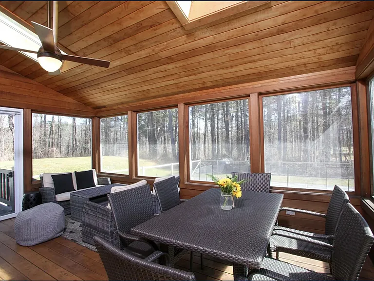Screen-in porch is perfect for entertaining or reading a book