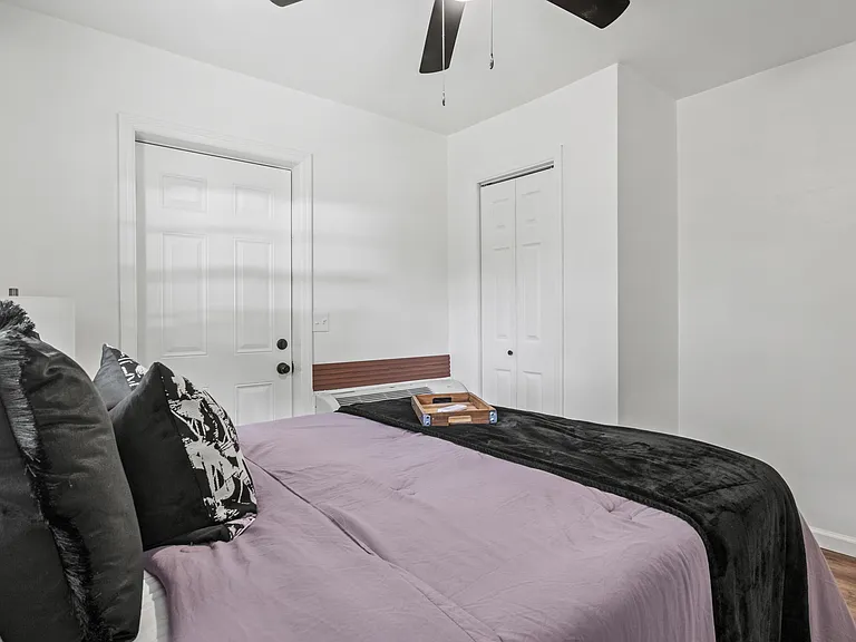 Larger door is to the backyard of the property, and the smaller door is the closet