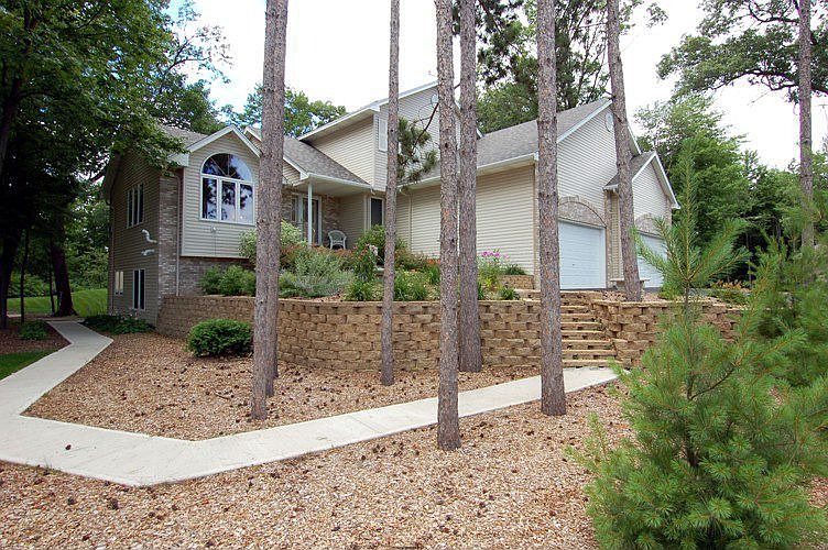 You'll feel like your up north in this fabulous Modified Two Story on one acre
