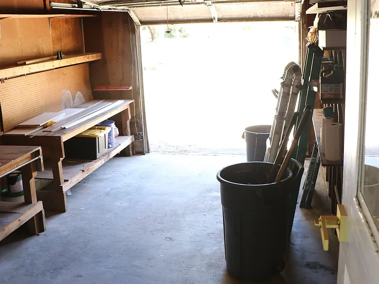 Garage with shelving and storage space.